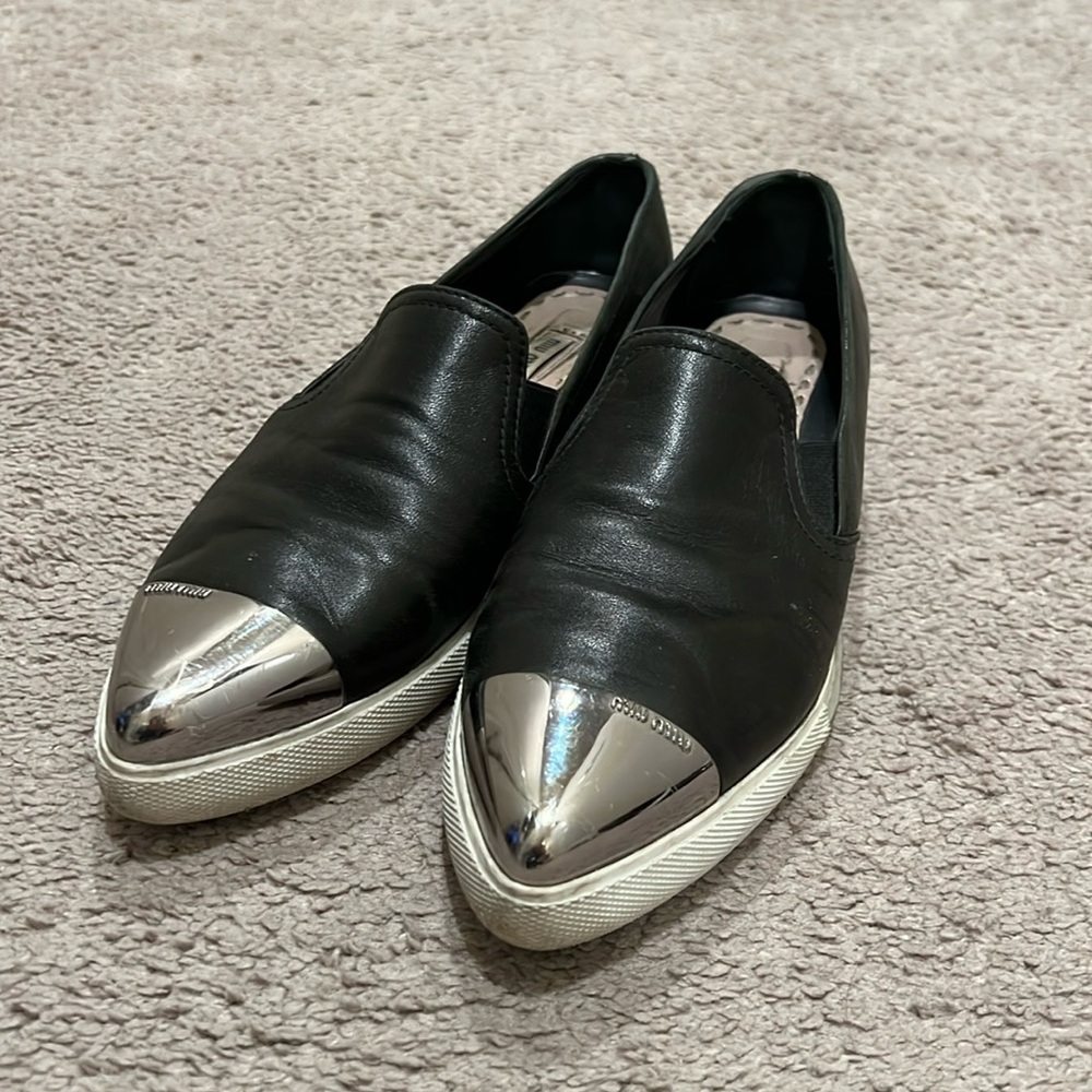 Miu Miu the perfect black metal slip ons